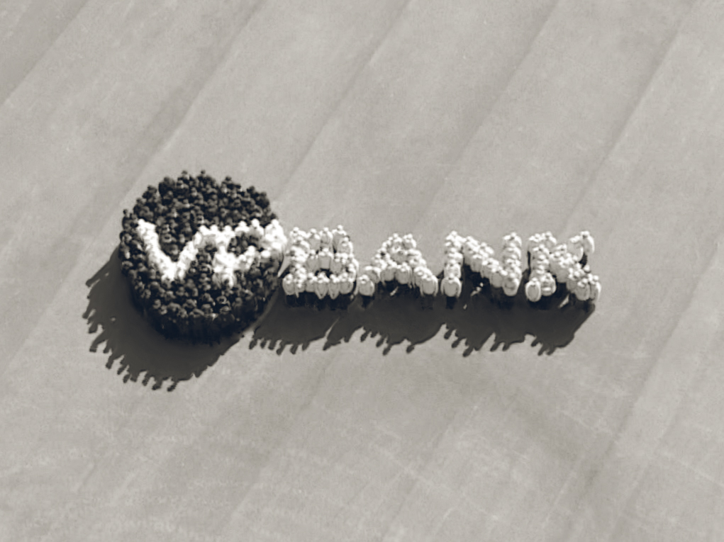 Mitarbeiter formen das Logo der VP Bank
